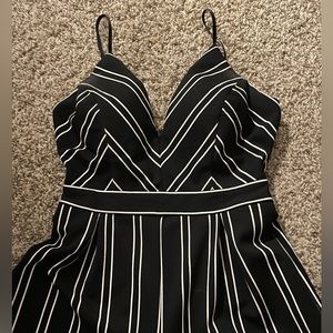 Dillards, brand honey and Rosie V printed black jumpsuit